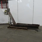 Hennig KUP-0257-00 Incline Chip Conveyor 8" Belt 8FPM 42" To 56" Disch 220V 3PH Used. Price: $738.29.