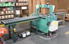 Fully Automatic Strapping Machine, Landen LP9A, With 2 Gravity Roller Conveyors Used. Price: $7200.00.